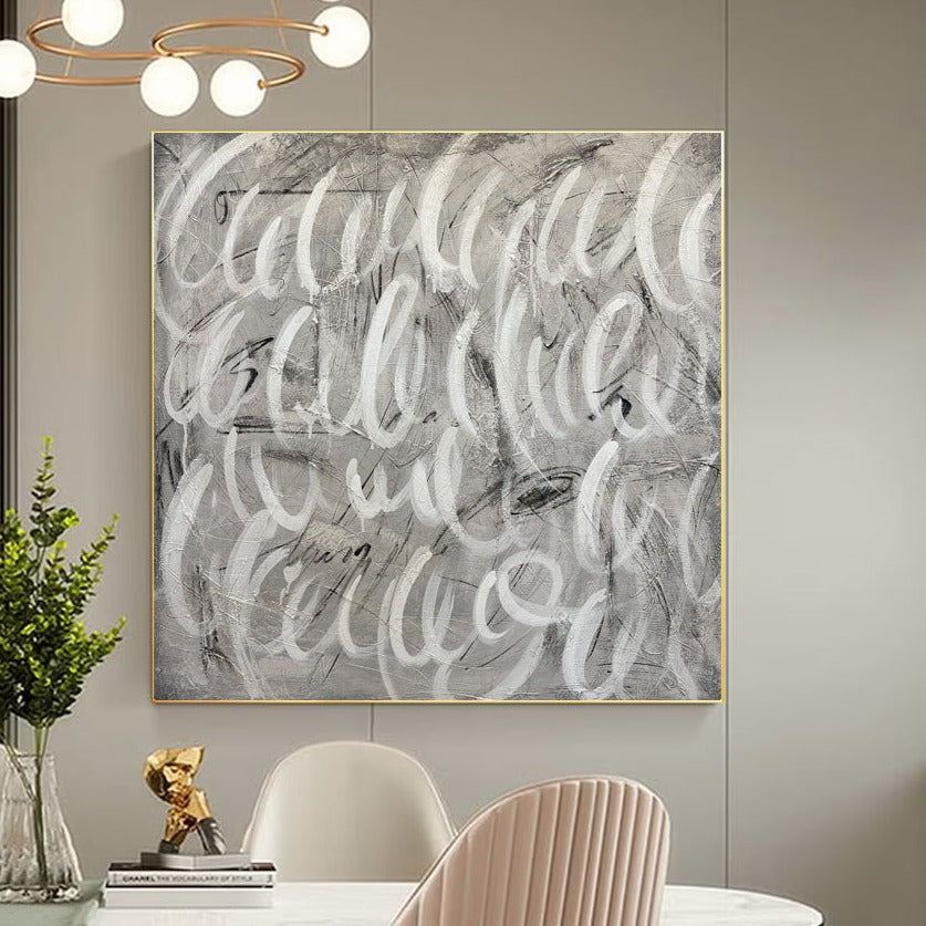 a dining room table with chairs and a painting on the wall