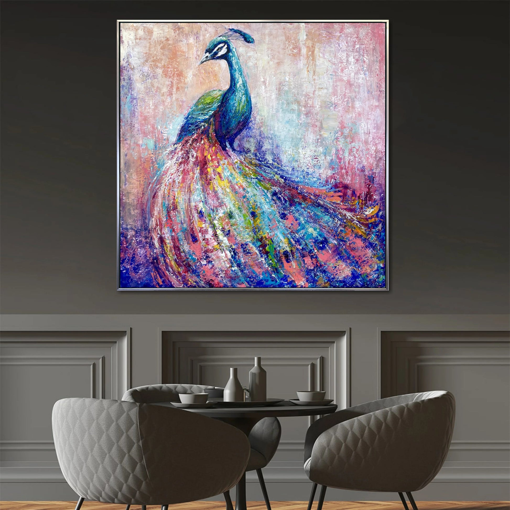 a large, colorful painting of a peacock displayed on a wall above a dining table with chairs.