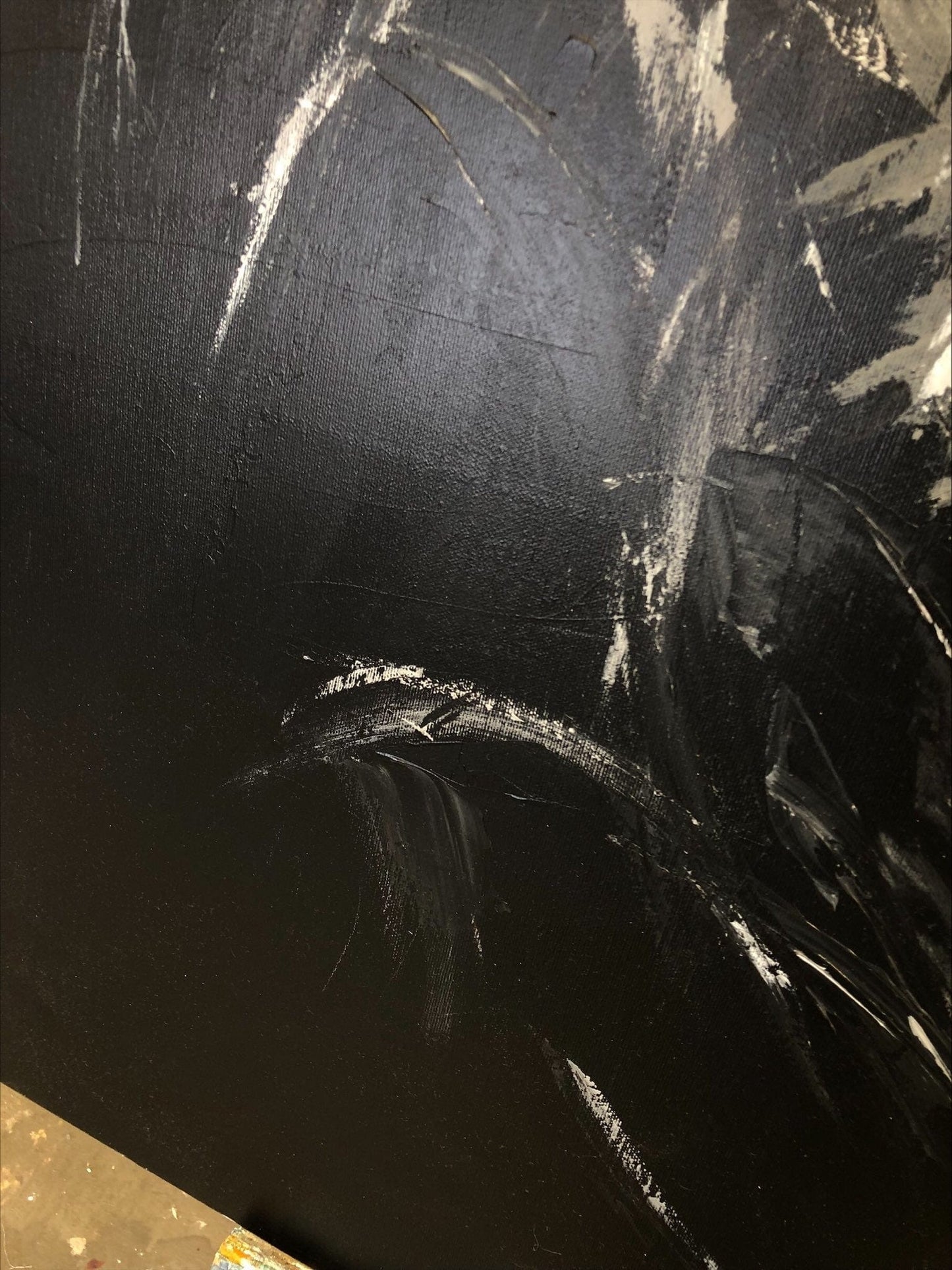 a close up of a black and white painting