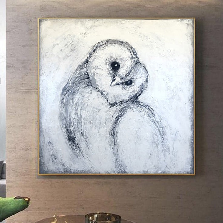 a drawing of an owl is hanging on a wall