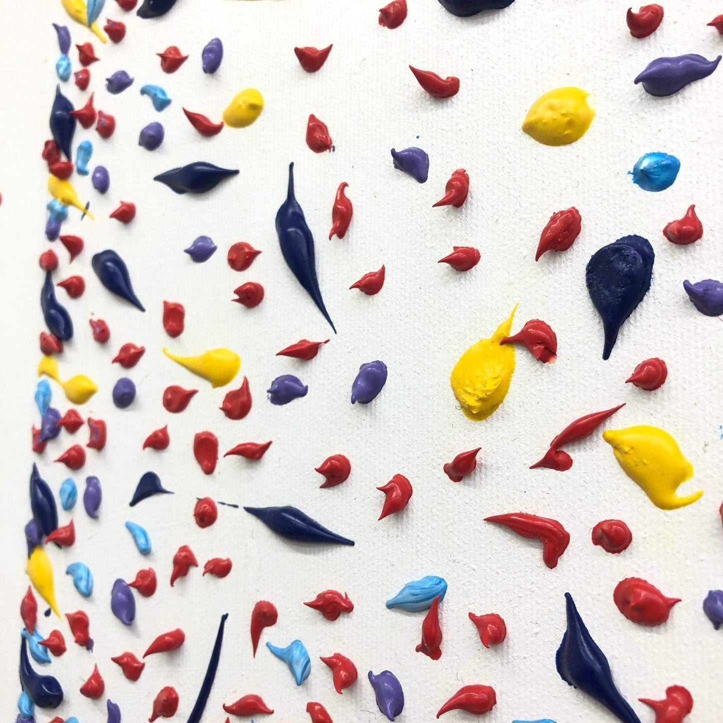 a close up of a cake decorated with multicolored sprinkles