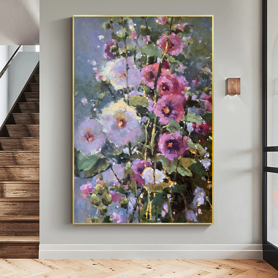 a painting hanging on a wall next to a stair case