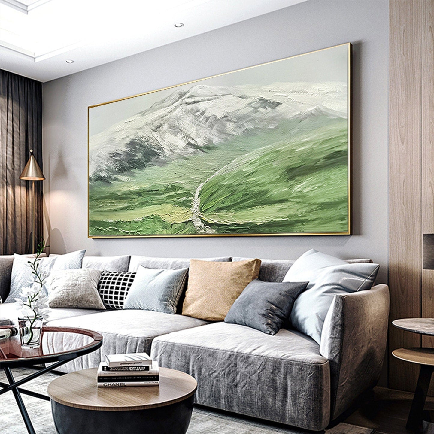 a living room filled with furniture and a painting on the wall