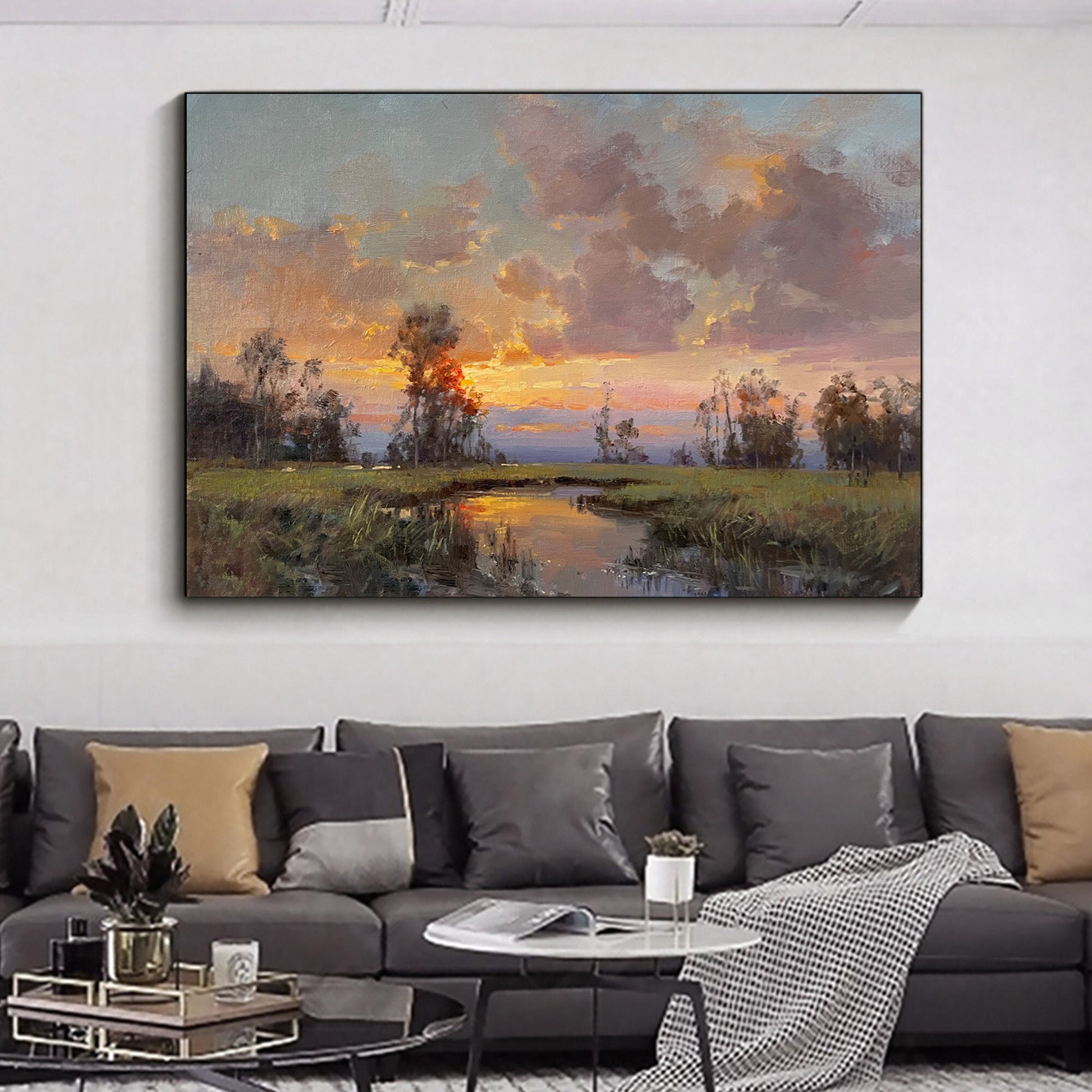 a living room with a couch and a painting on the wall