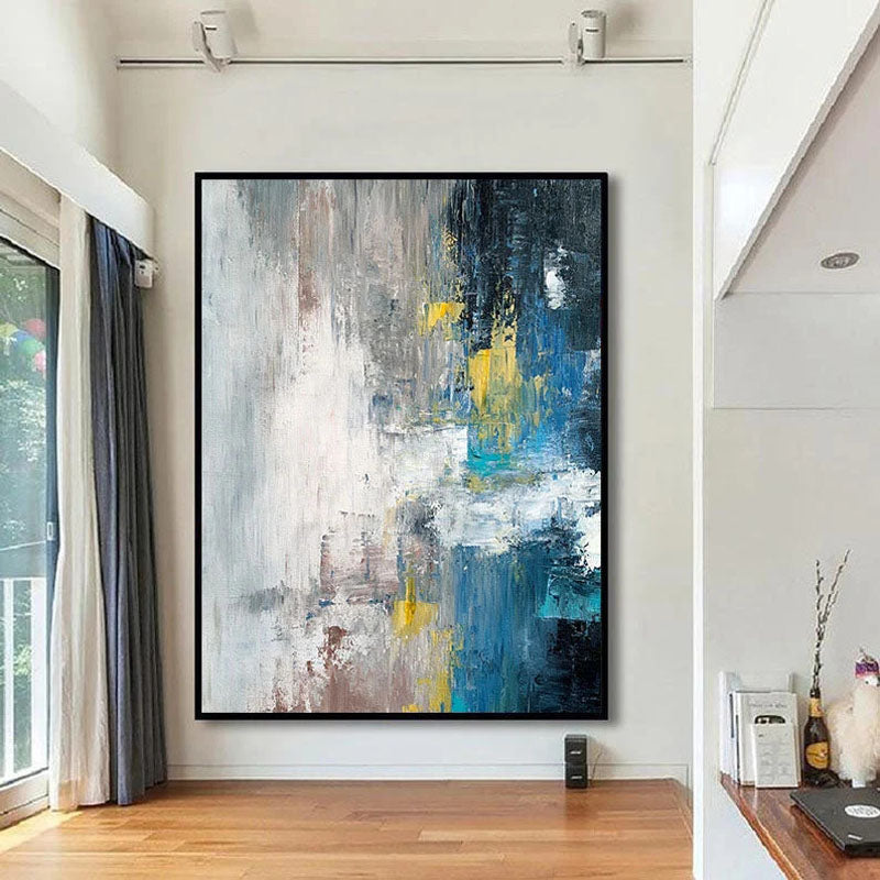 a painting hanging on a wall in a living room