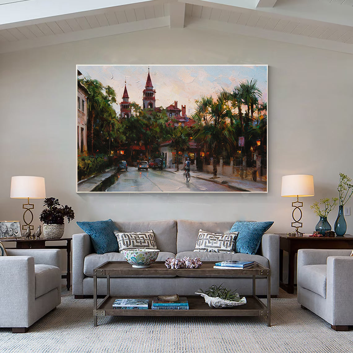 a living room filled with furniture and a painting on the wall