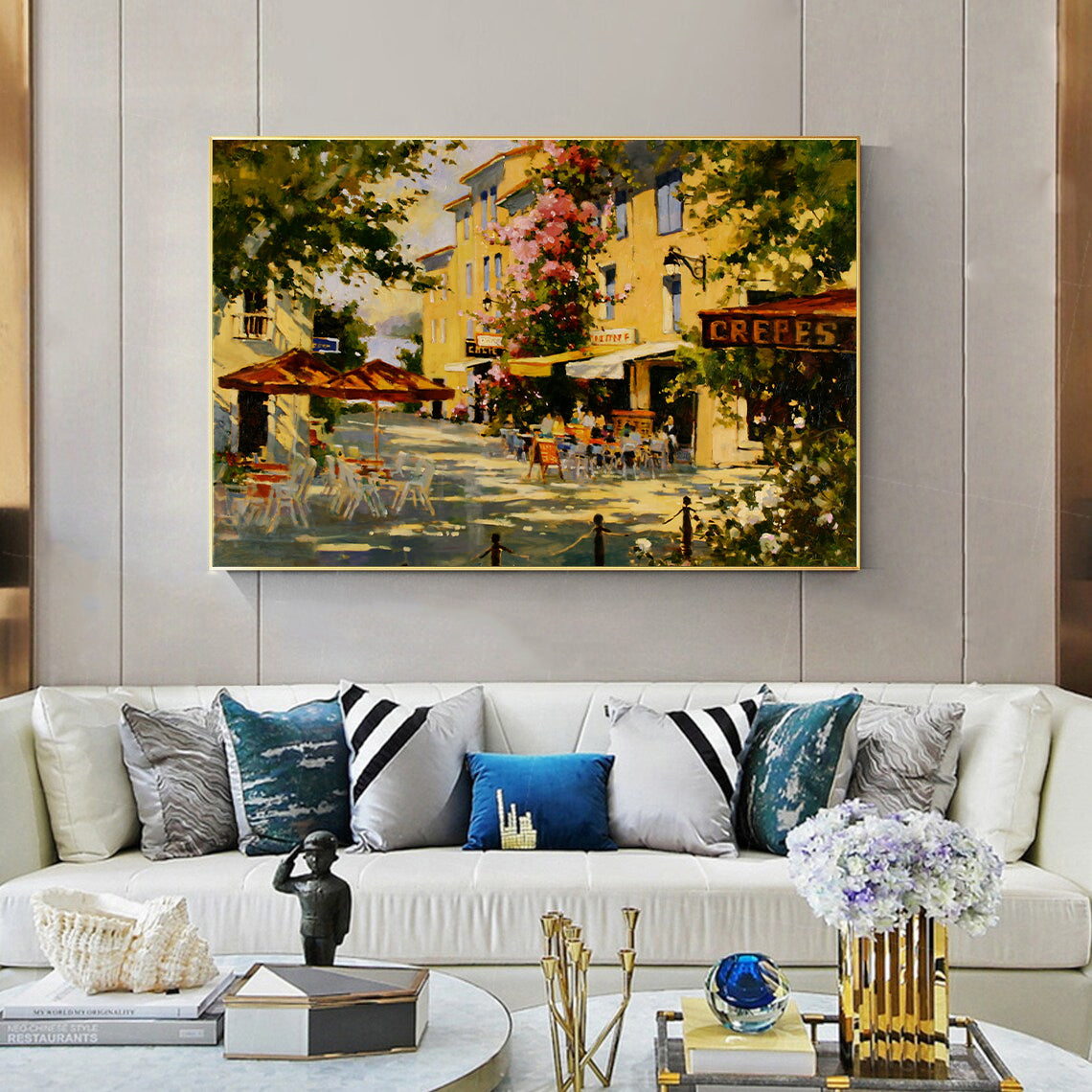 a living room filled with furniture and a painting on the wall