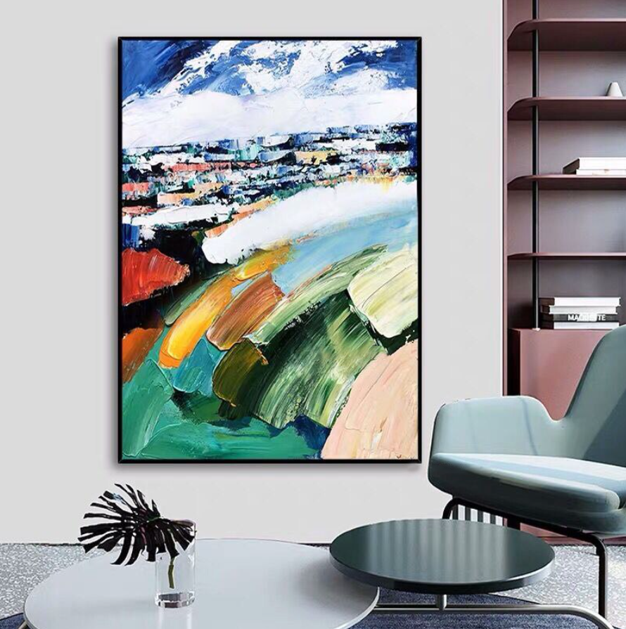 a living room with a painting on the wall