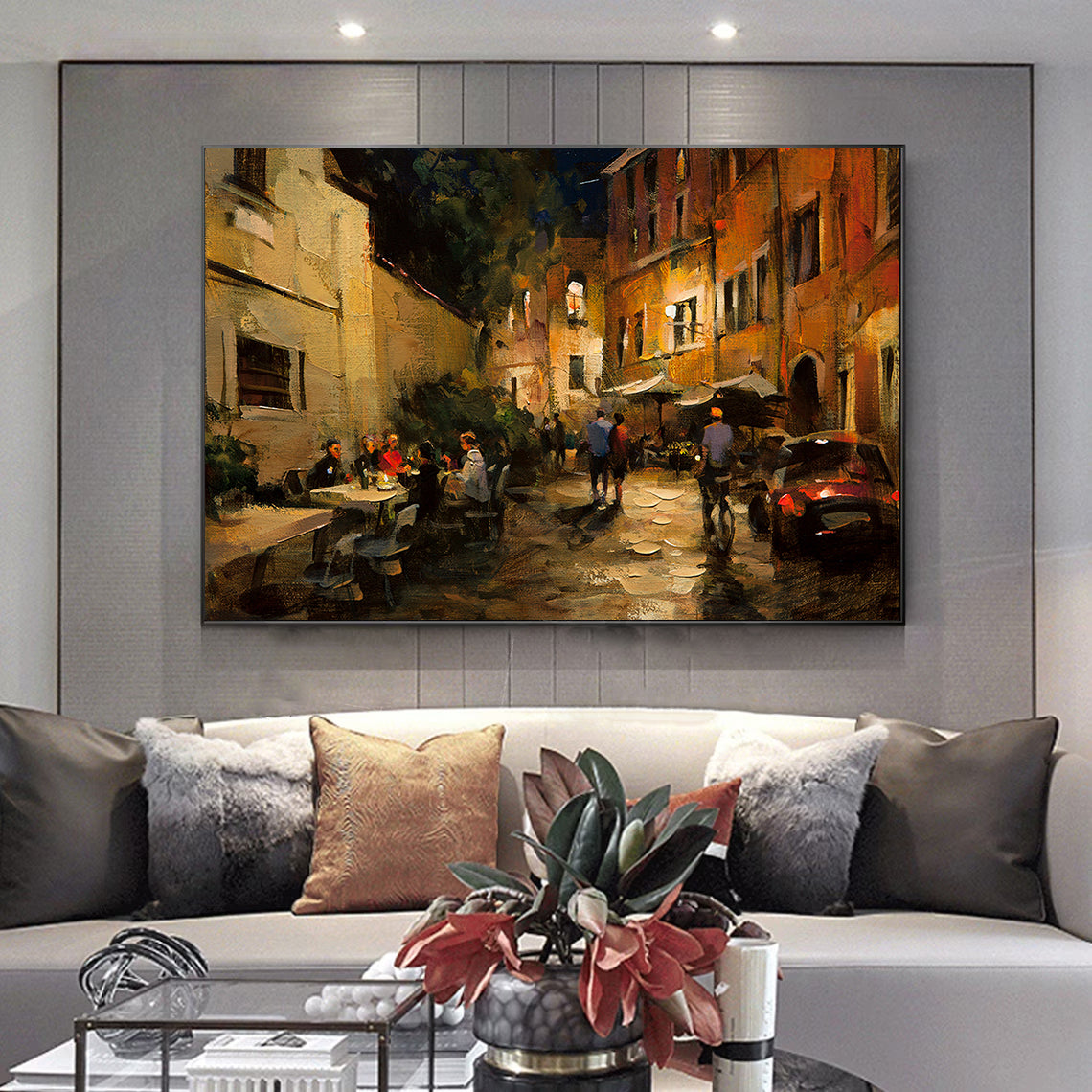 a living room with a couch and a painting on the wall