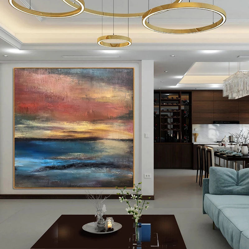a living room filled with furniture and a painting on the wall
