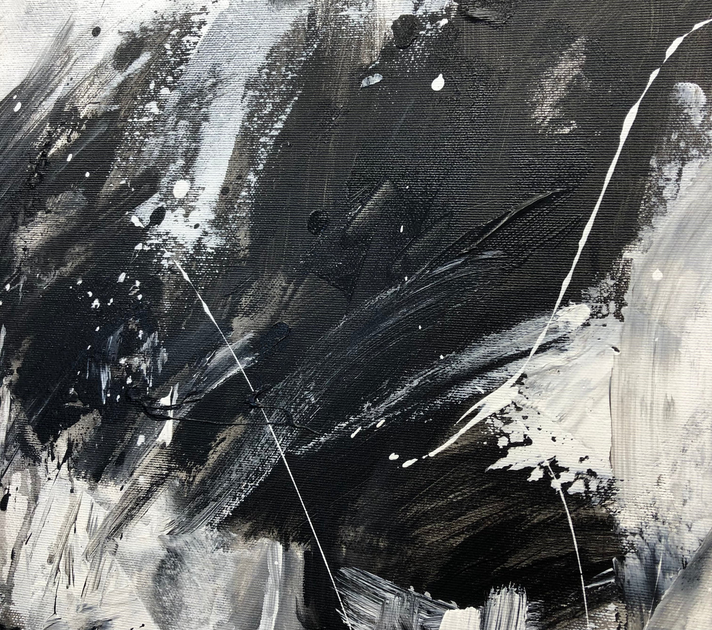 a painting of black and white paint on a canvas