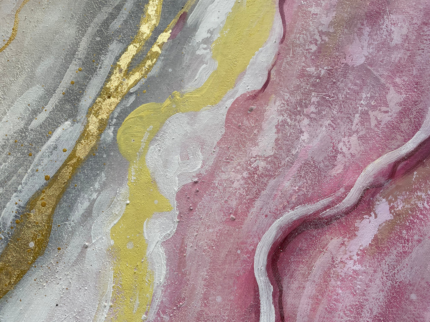 a close up of a pink and yellow marble