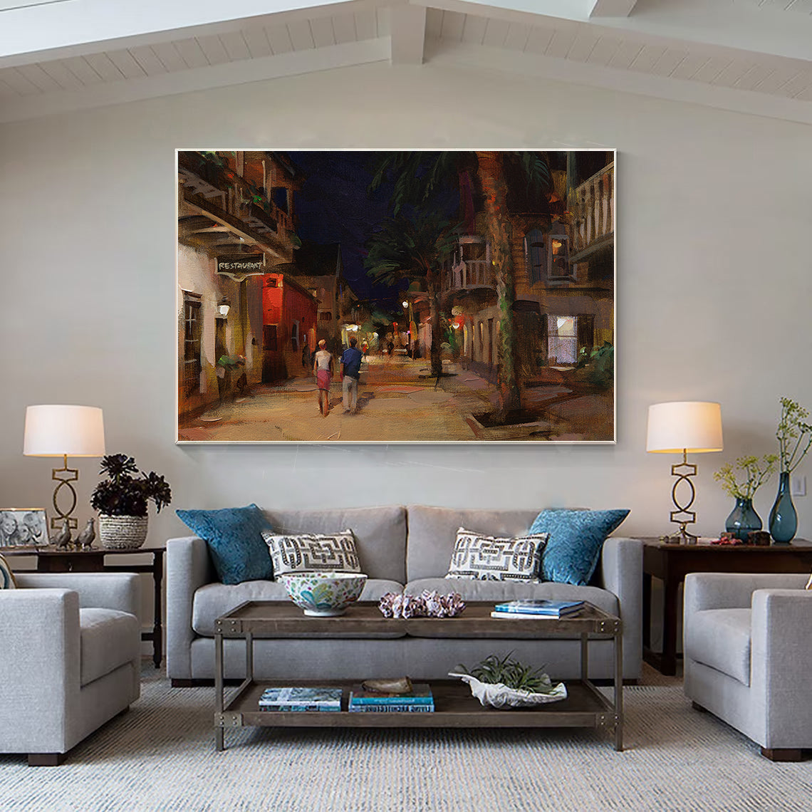 a living room filled with furniture and a painting on the wall