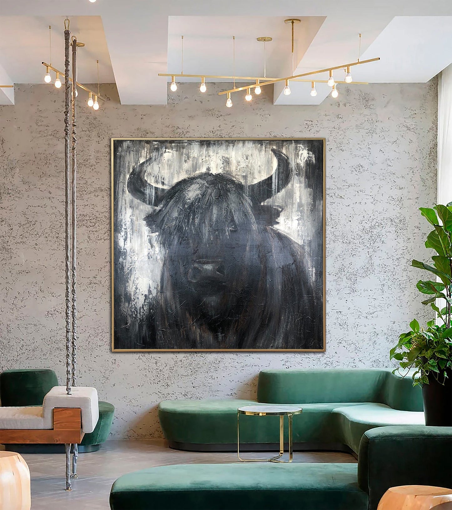 a living room with a painting of a bull on the wall