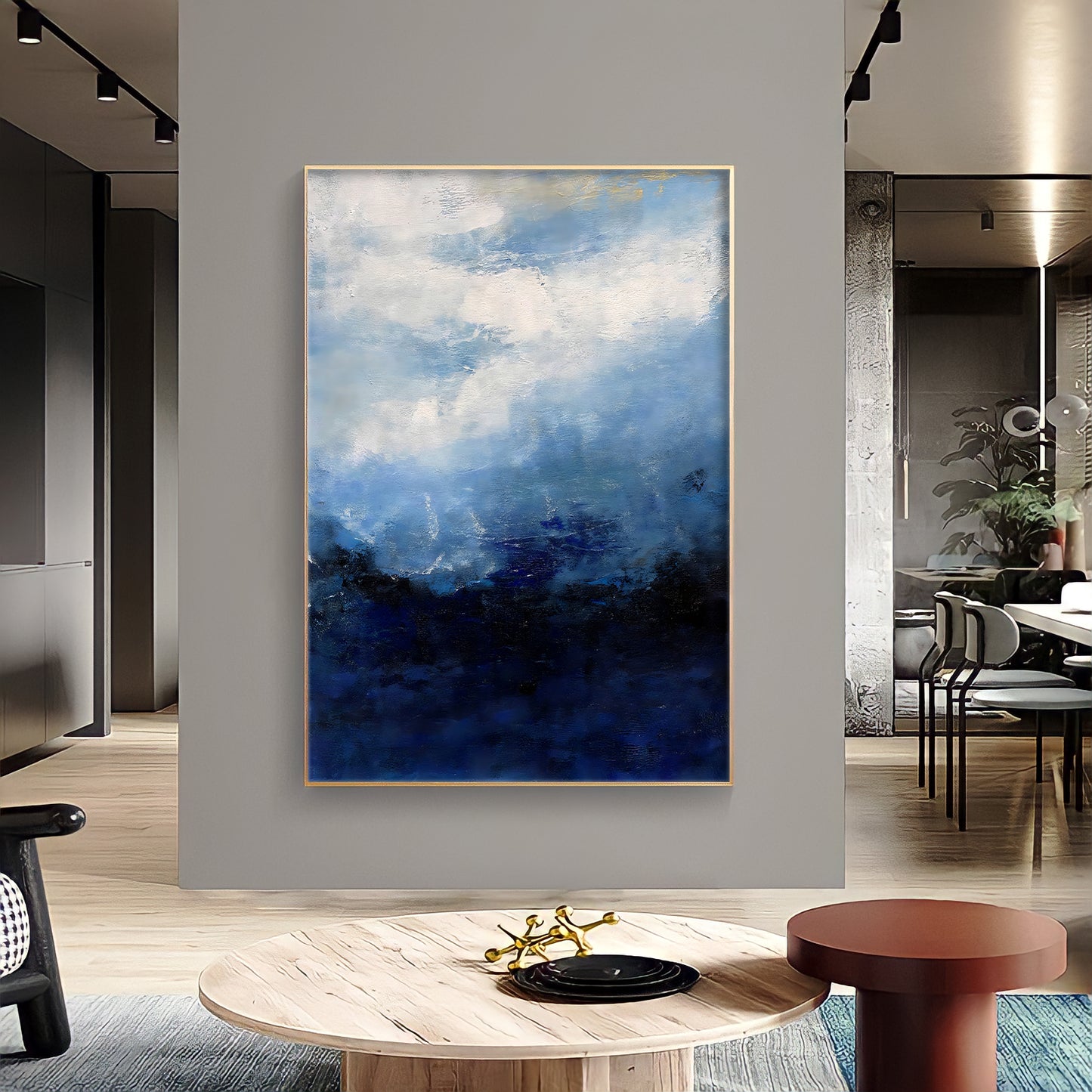 a painting hanging on a wall in a living room