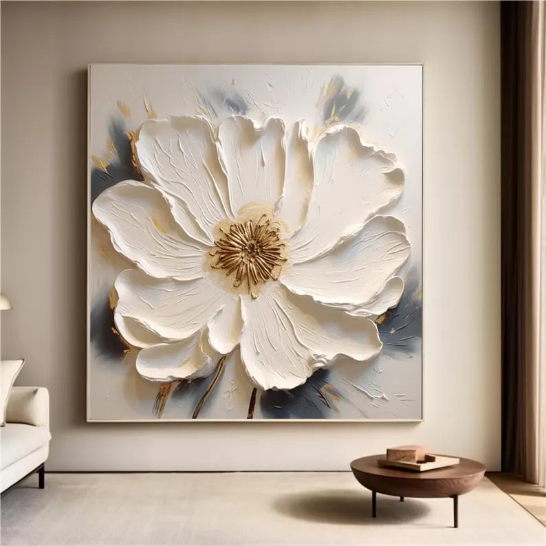 a living room with a large white flower on the wall