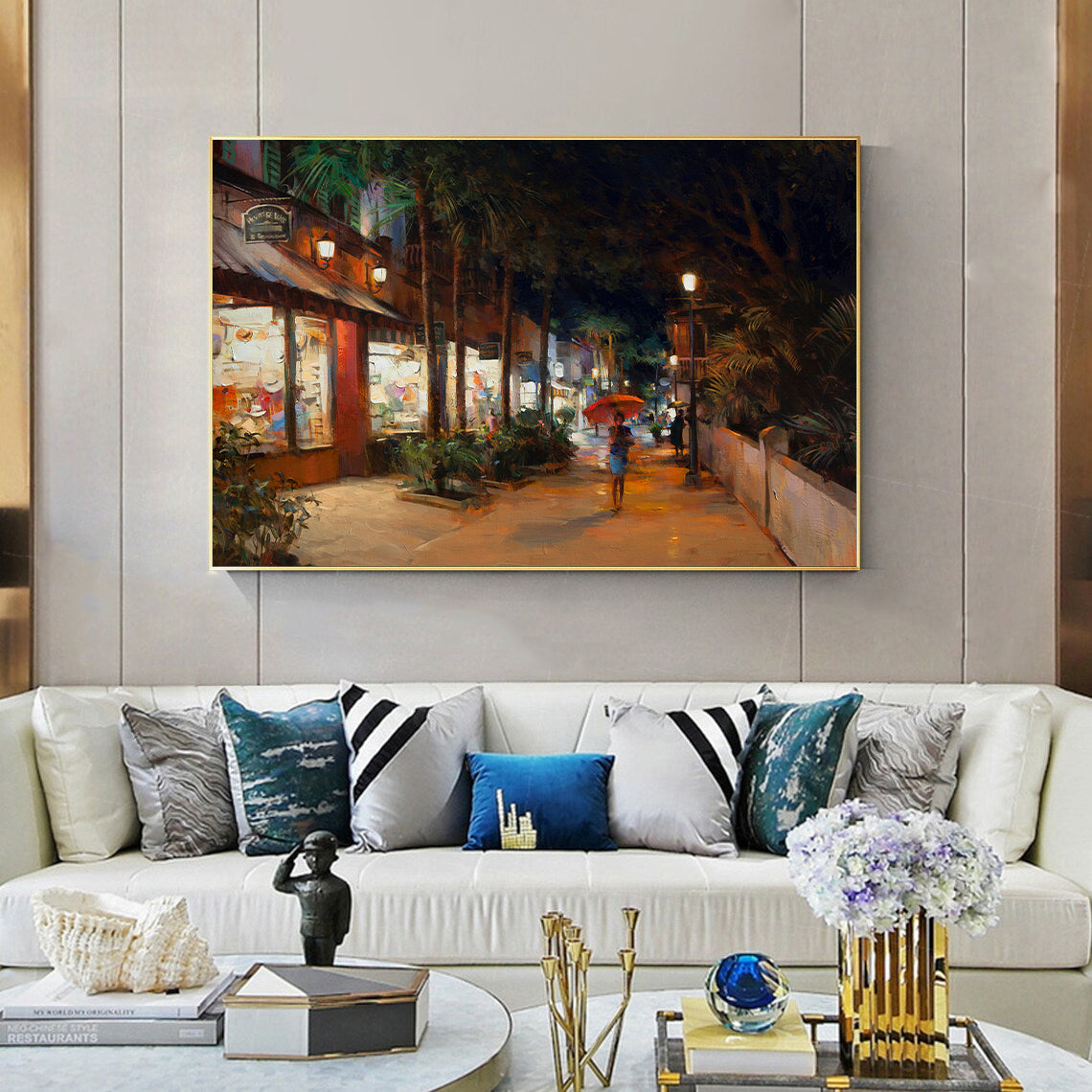 a living room filled with furniture and a painting on the wall