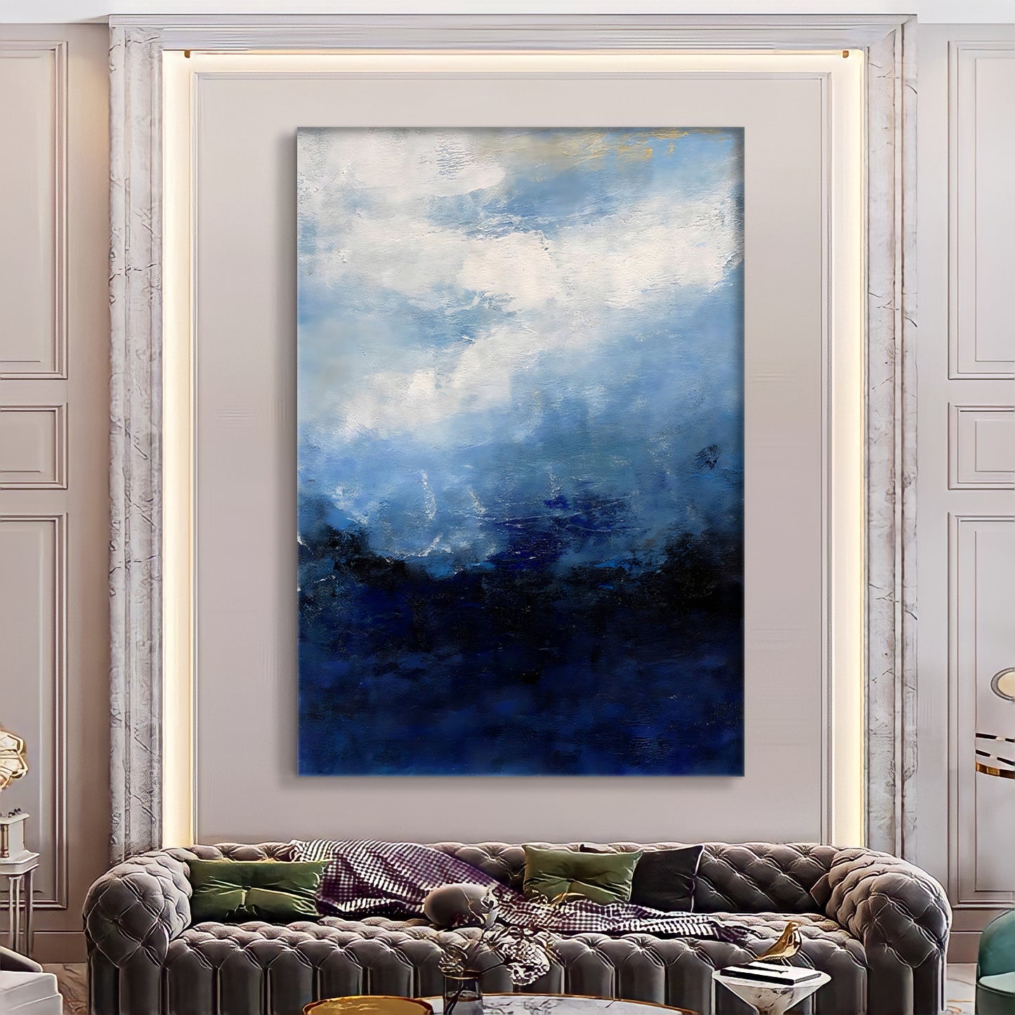 a living room with a couch and a painting on the wall