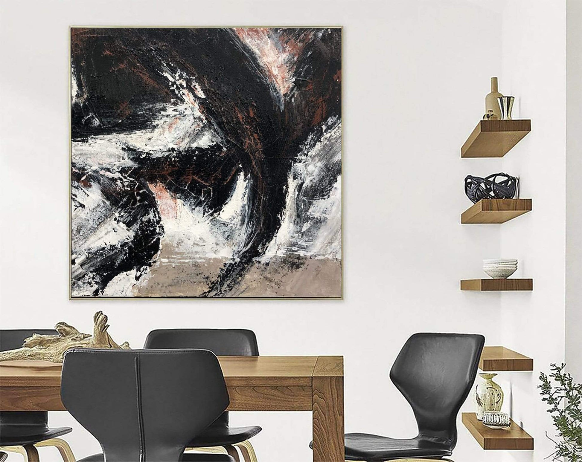 a dining room table with chairs and a painting on the wall