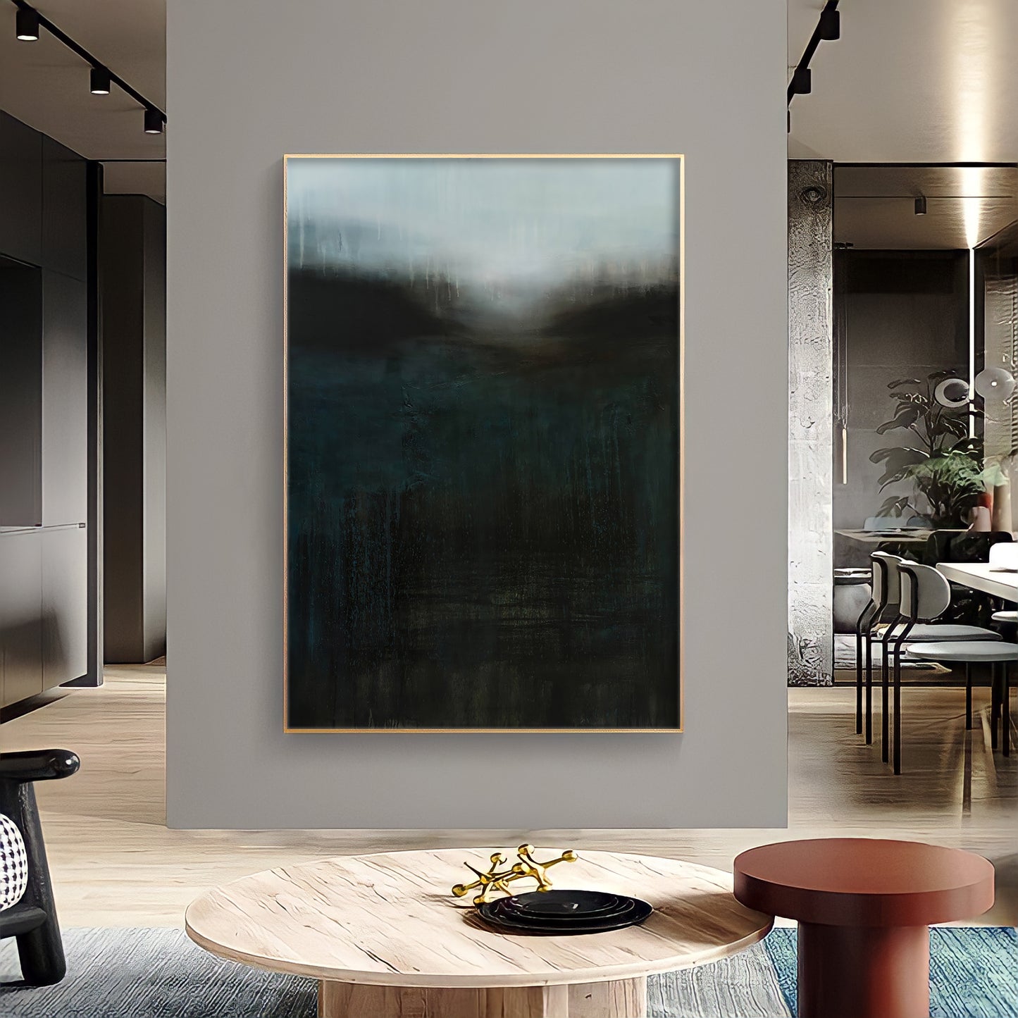 a living room with a painting on the wall