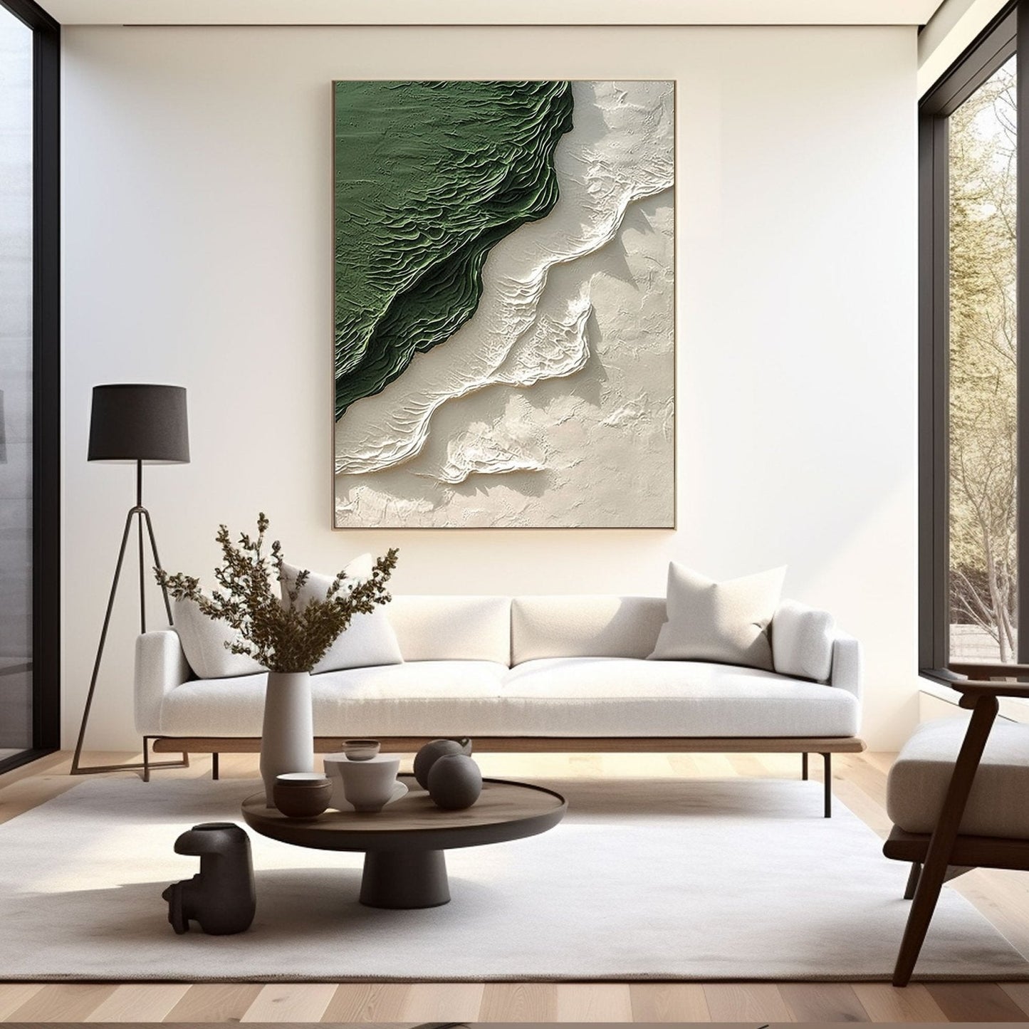 a modern living room with a large abstract painting on the wall, a white sofa, a coffee table with decorative items, and a large window providing natural light.