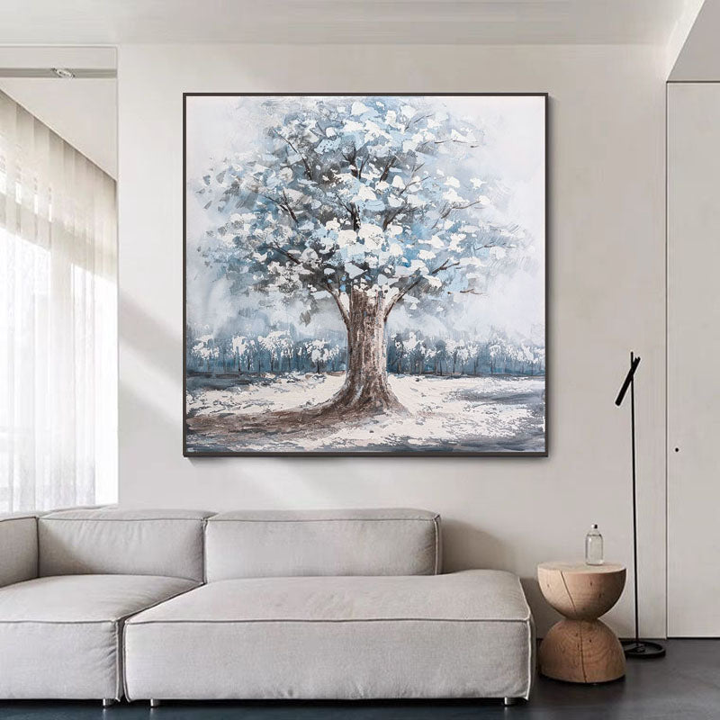 a living room with a couch and a painting on the wall