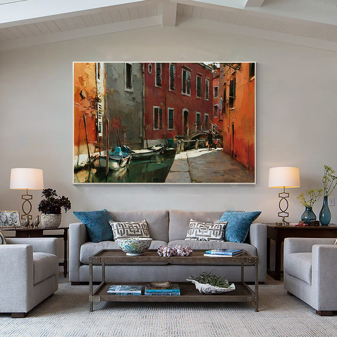 a living room filled with furniture and a painting on the wall