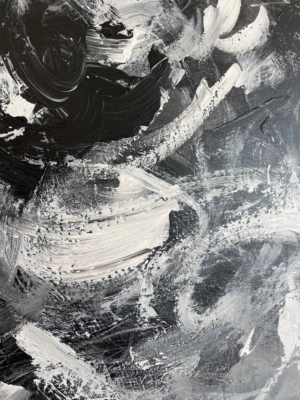 a black and white abstract painting with lots of paint