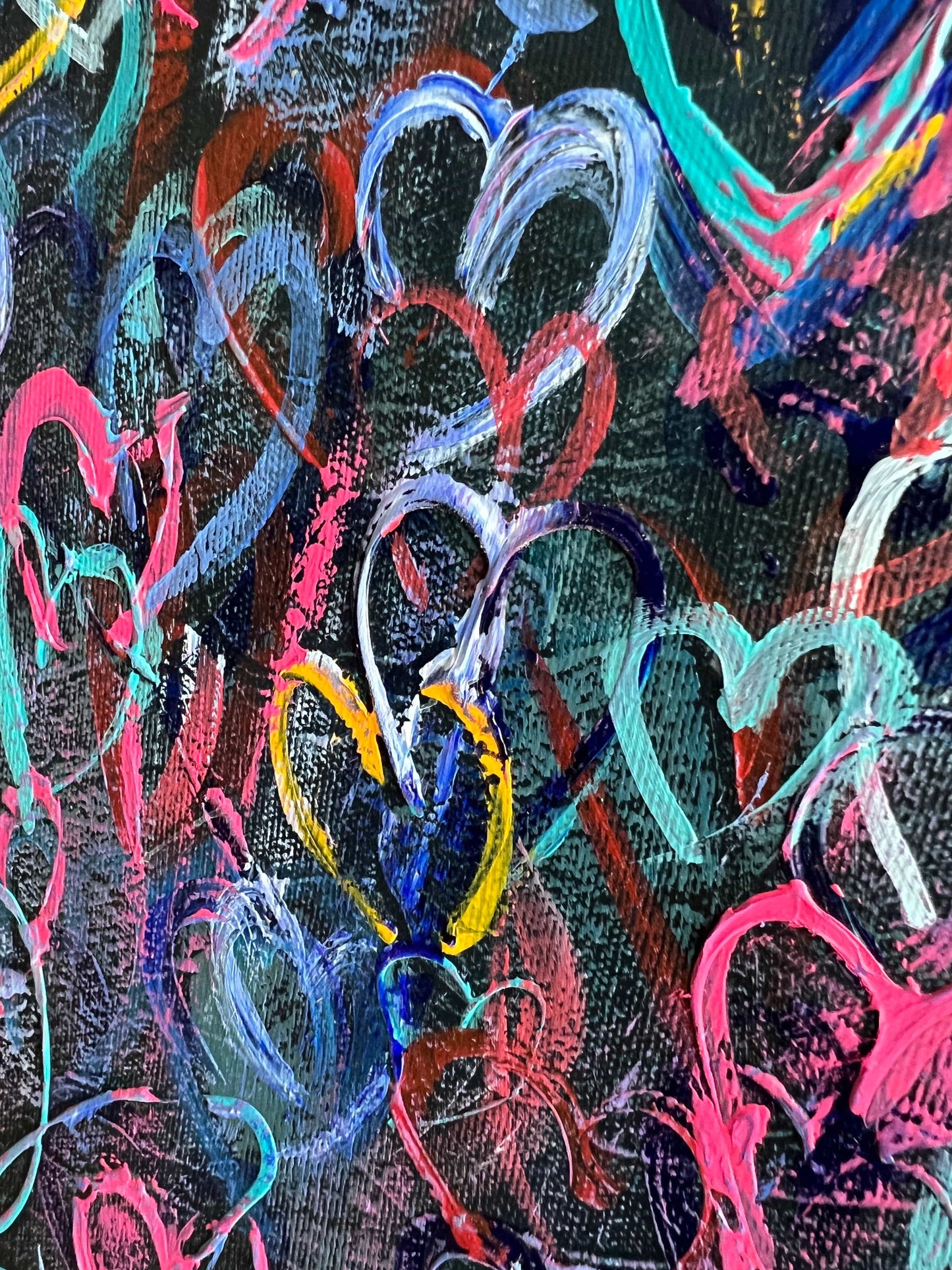 a close up of a painting of hearts