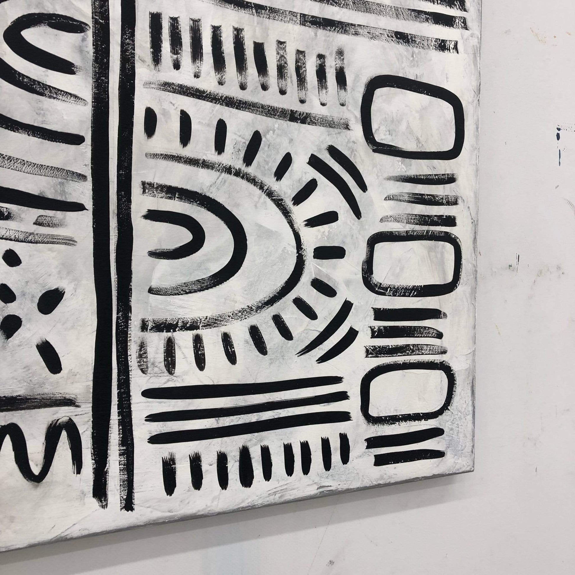 a black and white painting on a white wall