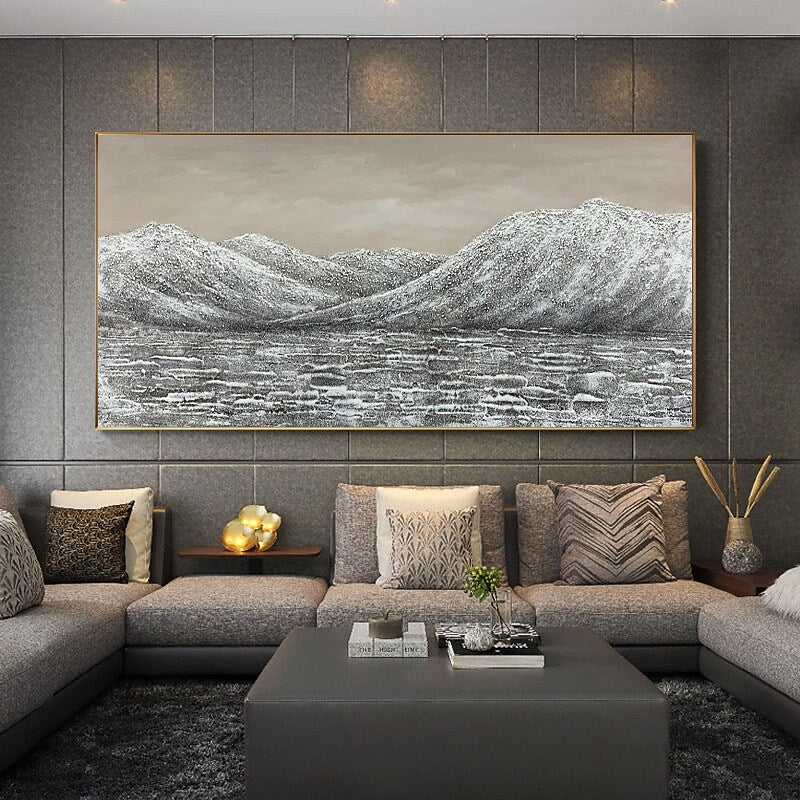 a living room with a large painting on the wall