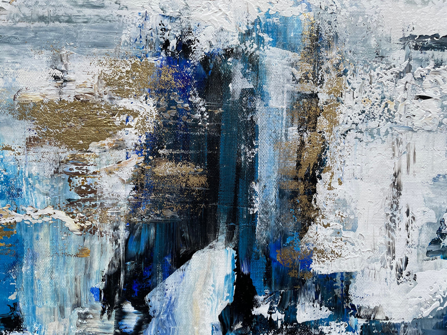 an abstract painting with blue, white, and gold colors