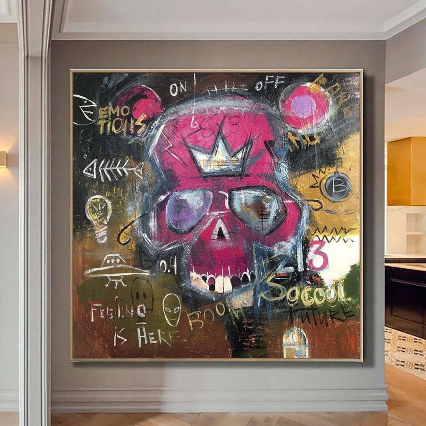 The image is a large, colorful painting of a skull with various texts and symbols surrounding it.