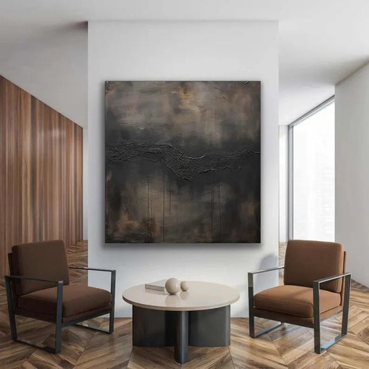 a modern living room with a large abstract painting on the wall, two brown armchairs, and a round coffee table.