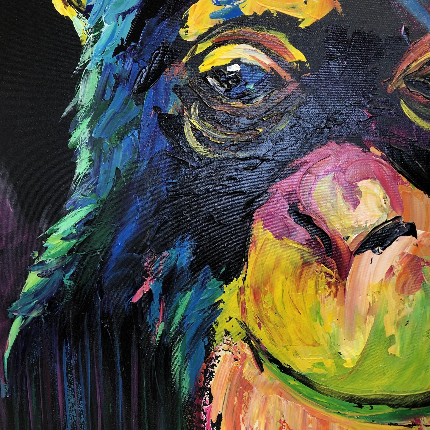 a painting of a dog's face painted in bright colors