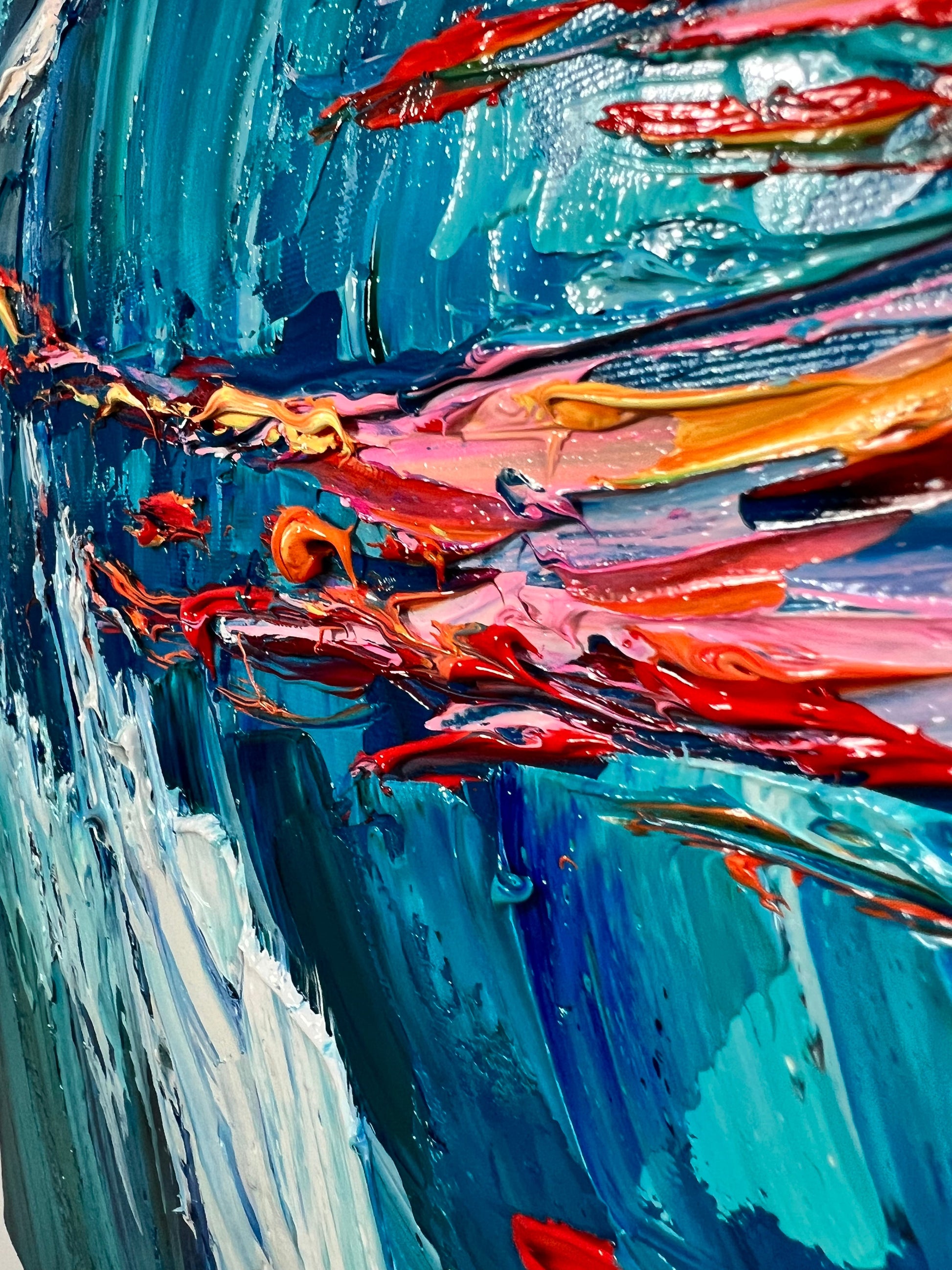 a painting of a wave with red, blue, and yellow colors