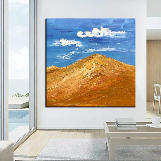 a living room with a painting on the wall