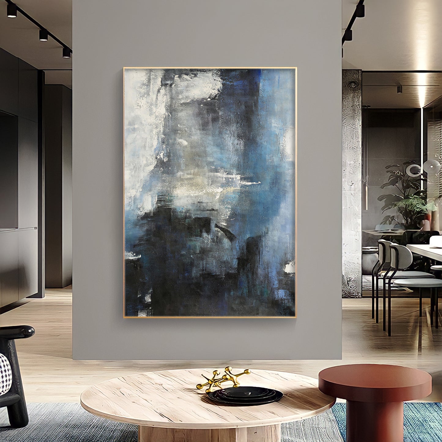 a painting hanging on a wall in a living room