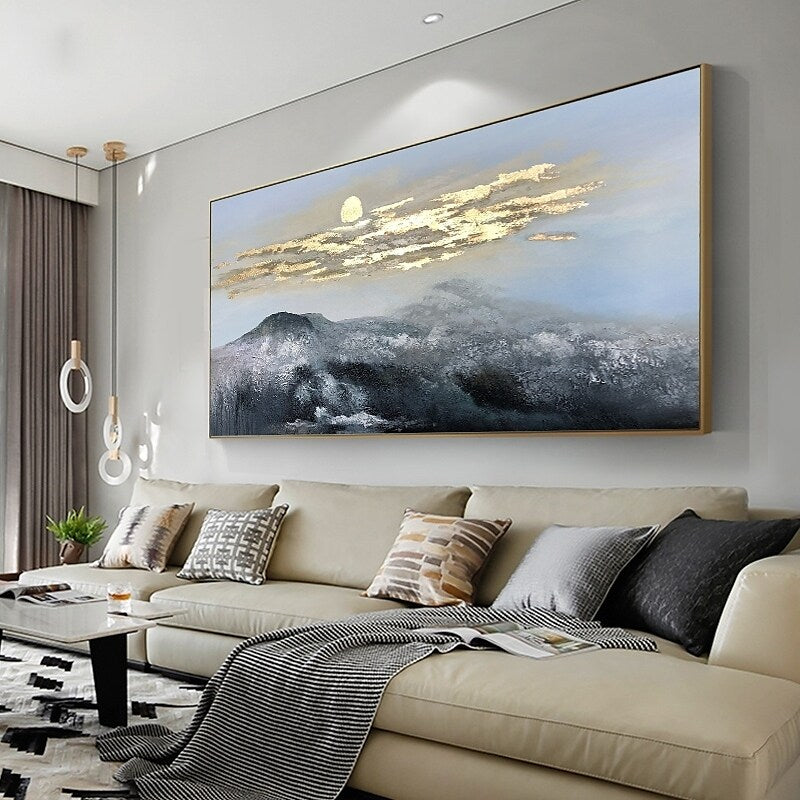 a living room with a large painting on the wall