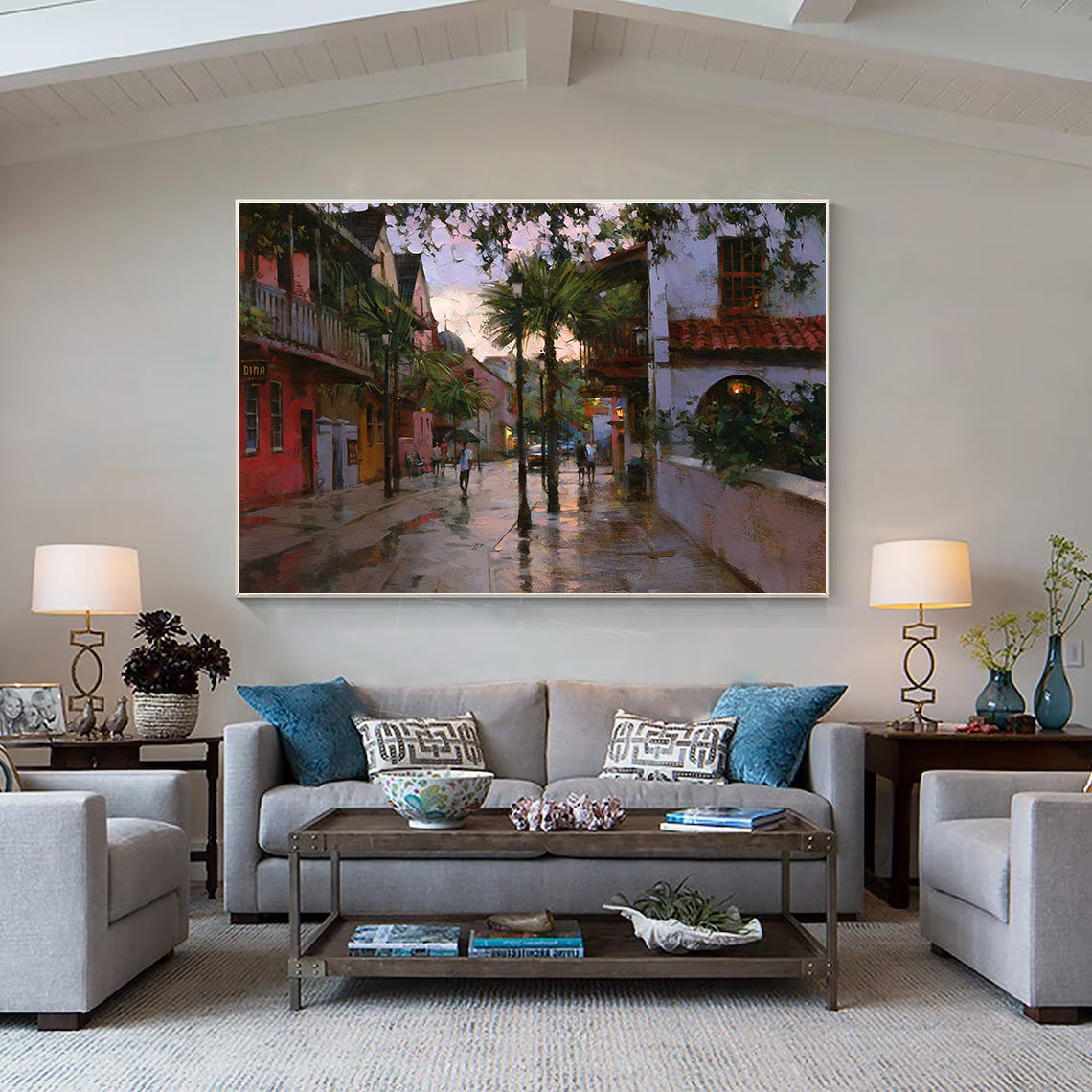 a living room filled with furniture and a painting on the wall