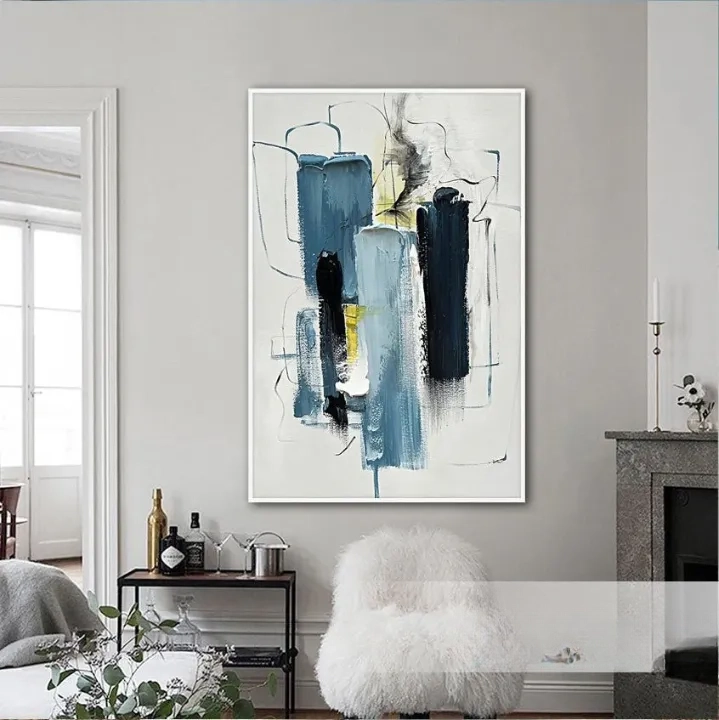 a large abstract painting hanging on a wall in a living room.