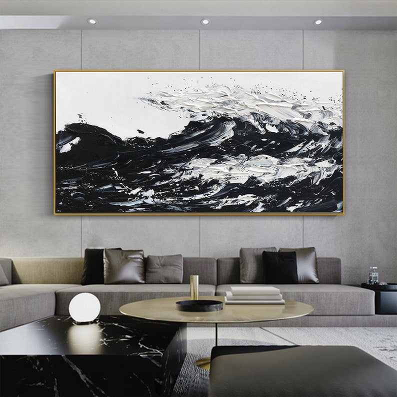 a living room with a large painting on the wall