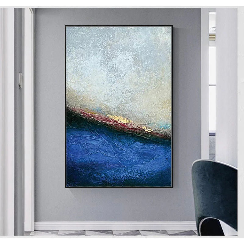 a painting hanging on a wall in a room