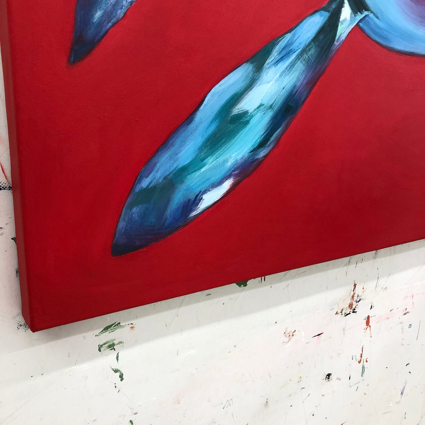 a painting of a blue tie on a red background