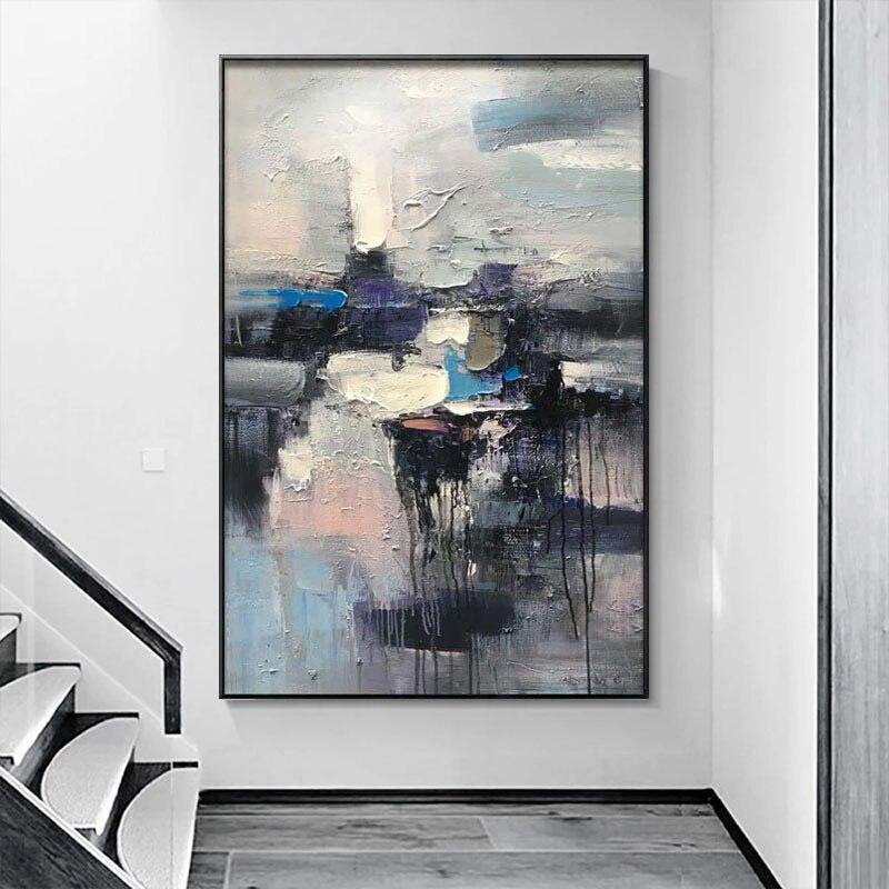 a painting hanging on a wall next to a stair case