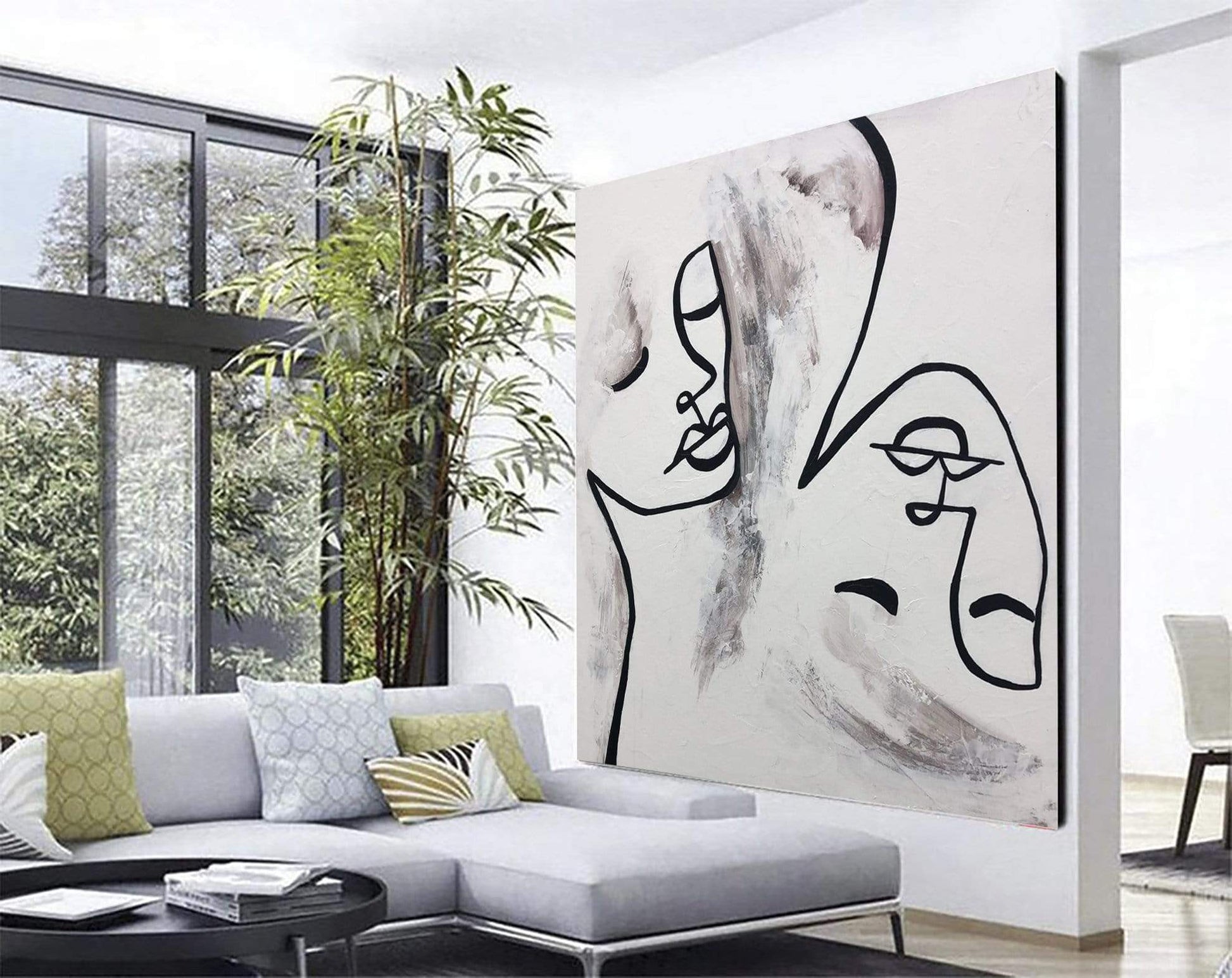 a living room with a large painting on the wall