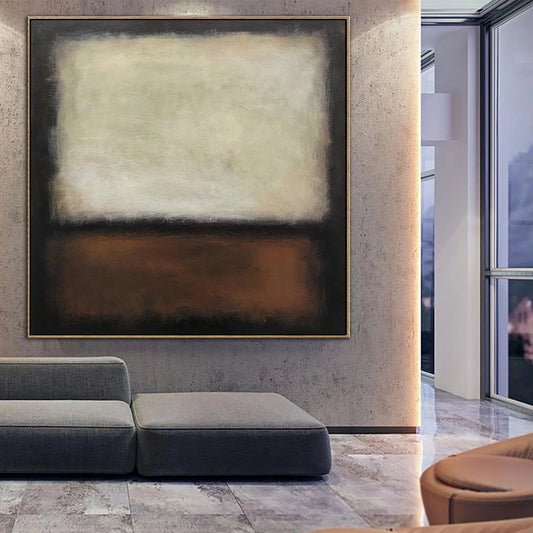 a modern living room with a large abstract painting hanging on the wall. The painting has a predominantly white background with a brown horizontal stripe. The room has a gray sofa and a circular chair, creating a contemporary and stylish atmosphere.