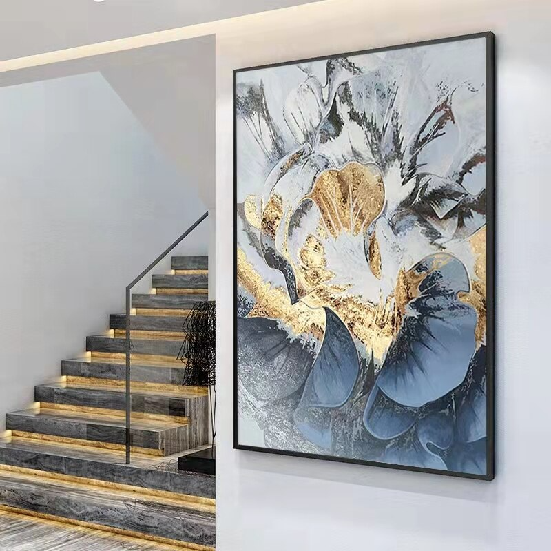 a painting hanging on a wall next to a stair case