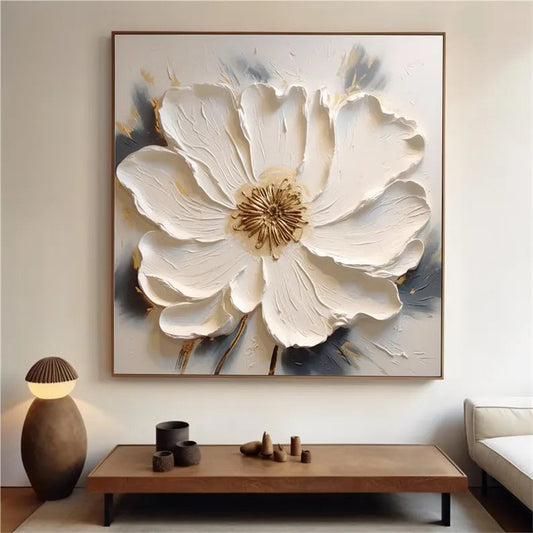 a living room with a large white flower on the wall