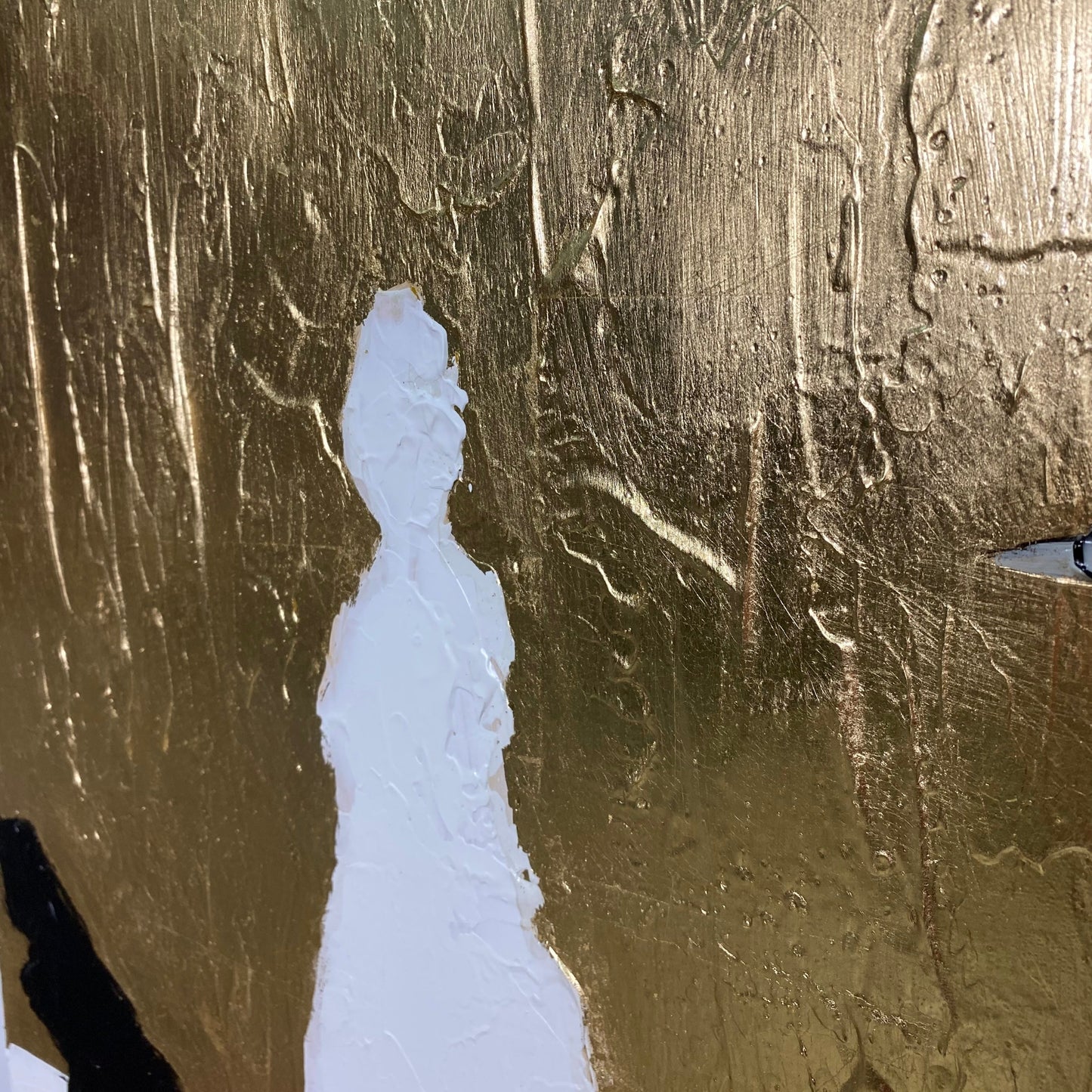 a white silhouette of a person against a textured golden background.